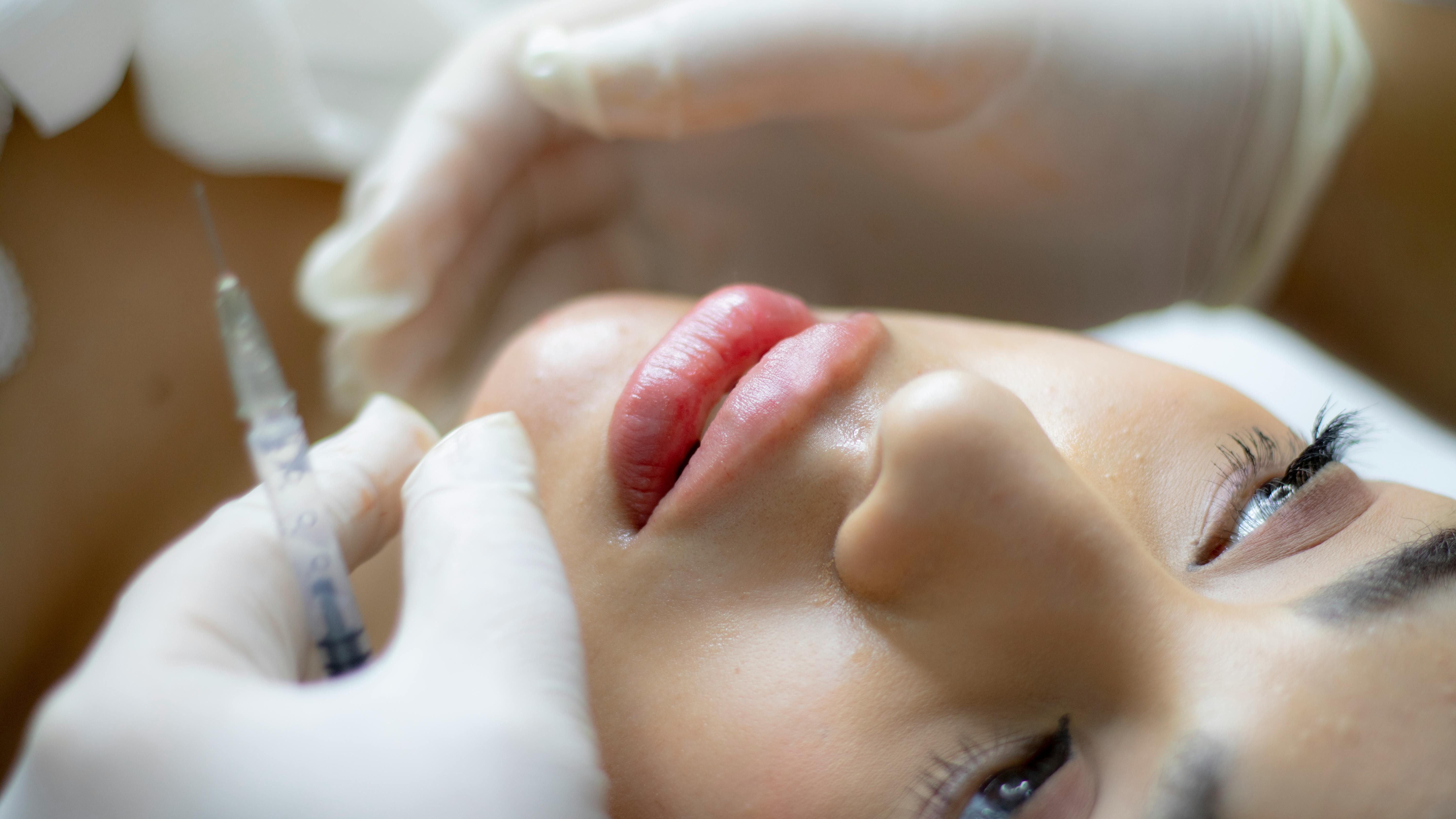 A practitioner preparing a dermal filler treatment at Wilbury Clinic