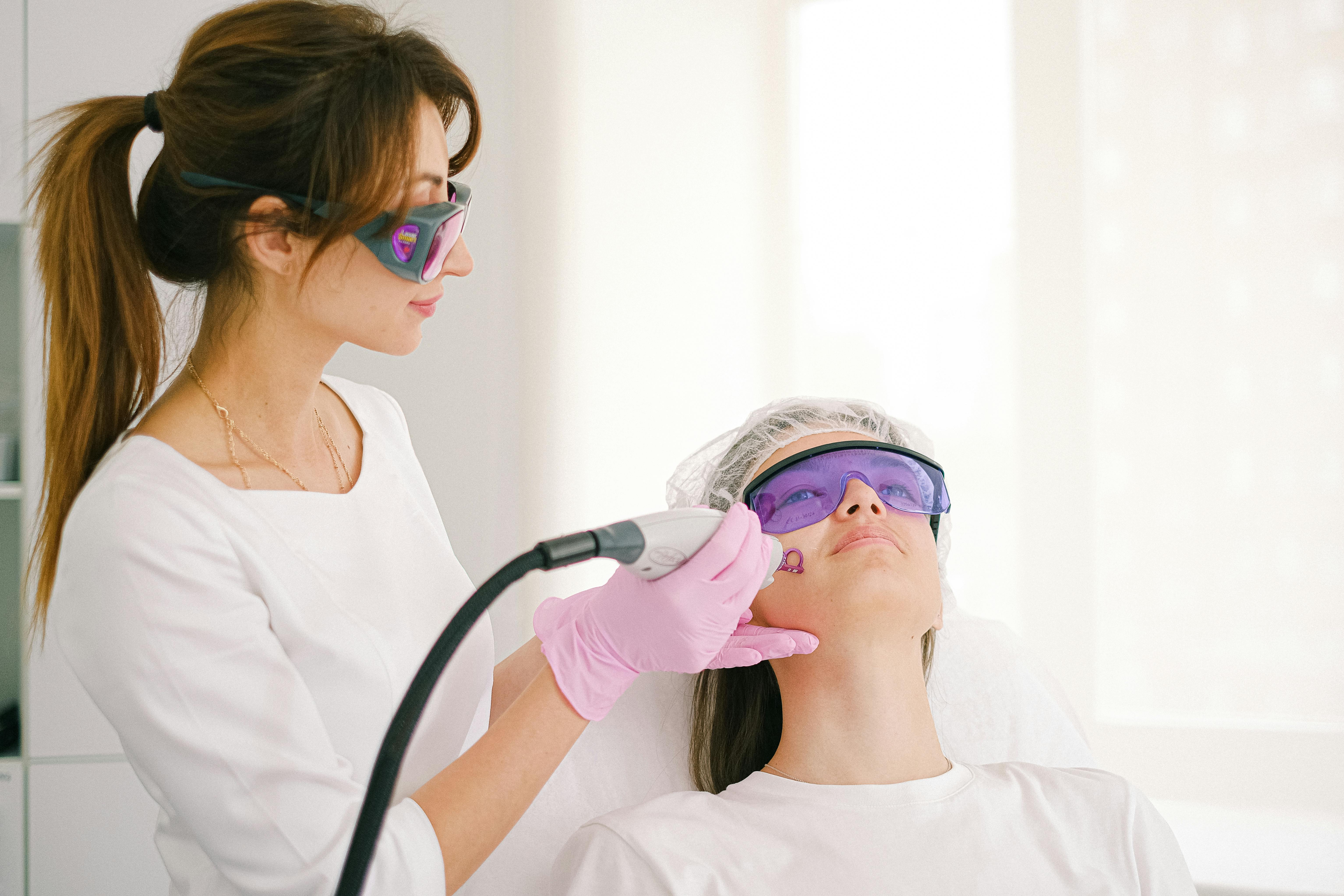 A practitioner preparing a laser tattoo removal session at Wilbury Clinic